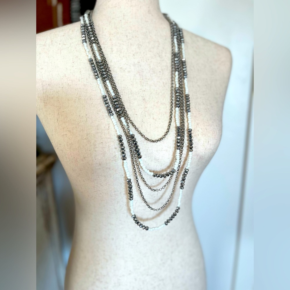 White and silver, 5 strand layered necklace.